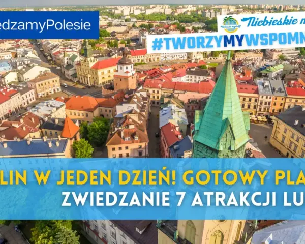 Widok z lotu ptaka na lubelskie Stare Miasto z zieloną wieżą kościelną i kolorowymi kamienicami.